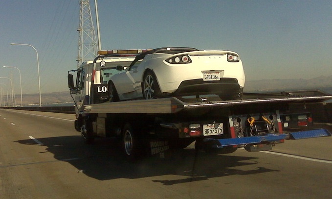 Roadster being towed Inoperable Tesla Roadster being towed on a flatbed.